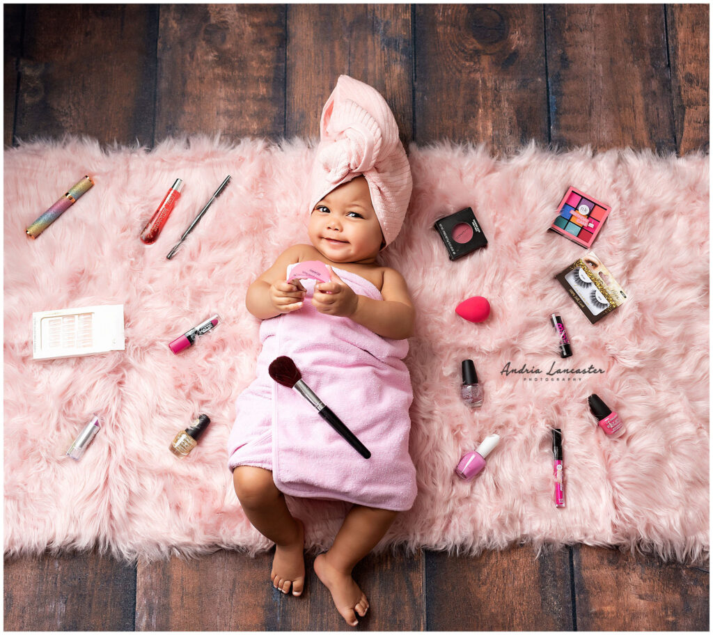 makeup setup on floor with 6 month old in the middle