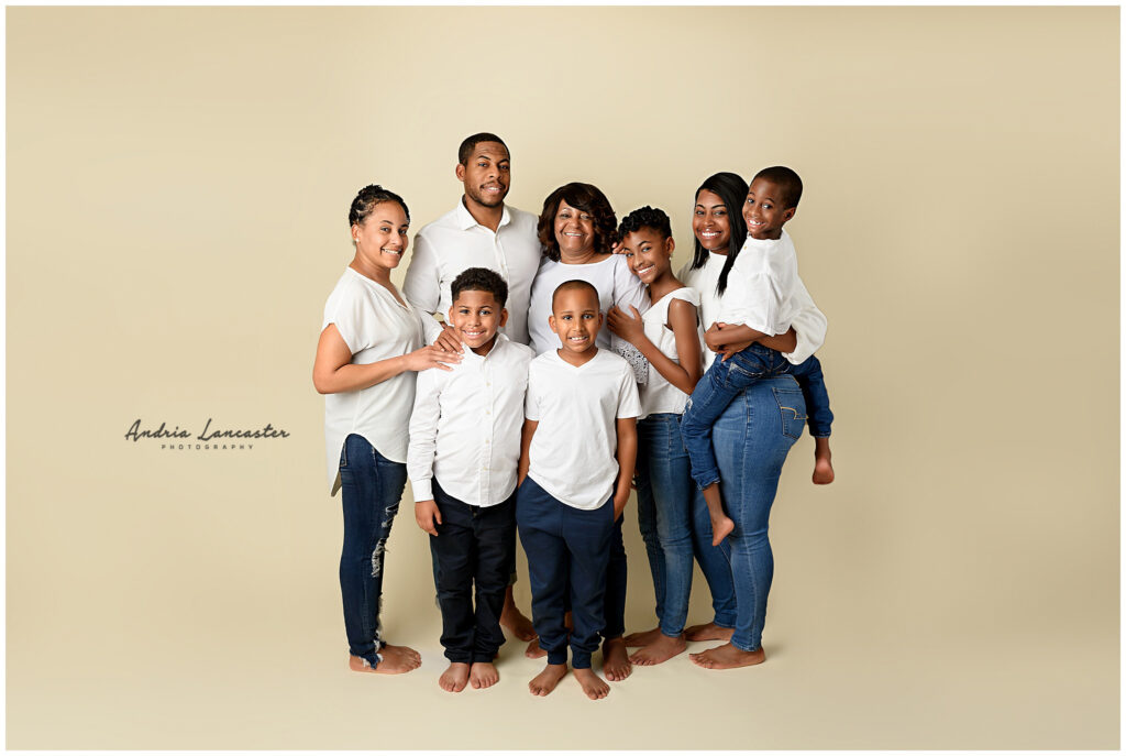 family of 8 in studio posed together