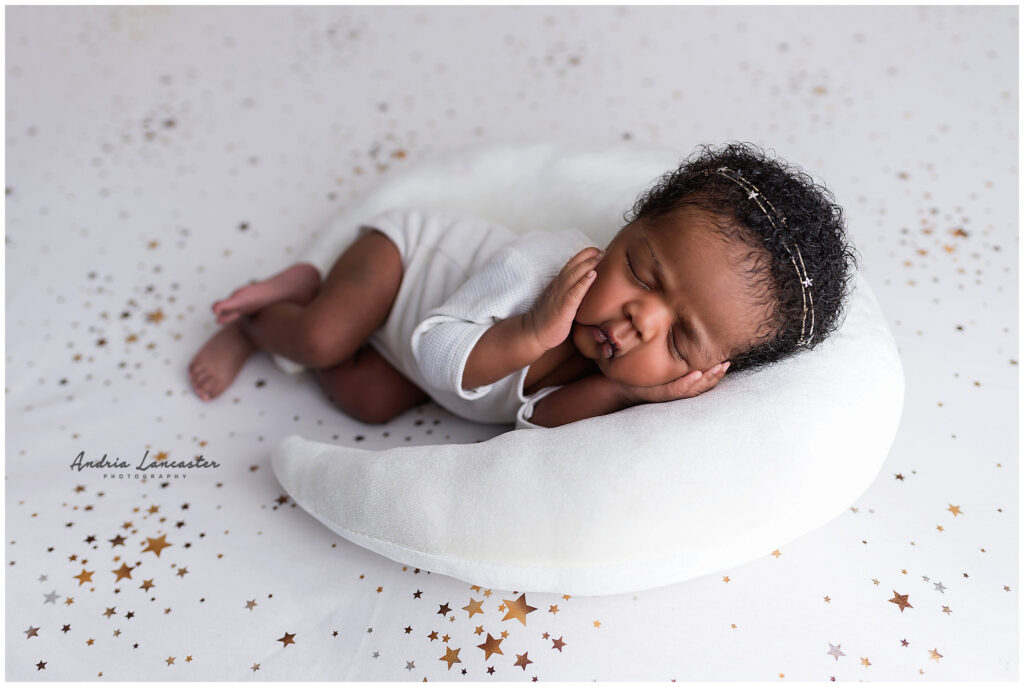 moon pillow and star backdrop used in newborn portraits