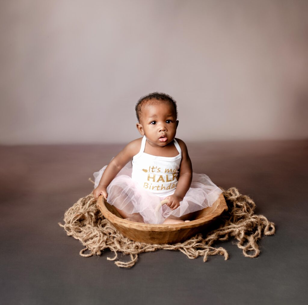 6 month Baby girl wearing a pink tutu dress in Brooklyn, NY Studio session